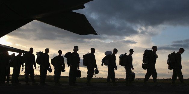 MONROVIA, LIBERIA - OCTOBER 09: U.S. Marines arrive to take part in Operation United Assistance on October 9, 2014 near Monrovia, Liberia. Some 90 Marines arrived on KC-130 transport planes and MV-22 Ospreys to support the American effort to contain the Ebola epidemic. The Ospreys, which can land vertically like helicopters, will transport U.S. troops and supplies as they build 17 Ebola treatment centers around Liberia. U.S. President Barack Obama has committed up to 4,000 troops in West Africa to combat the disease. (Photo by John Moore/Getty Images)