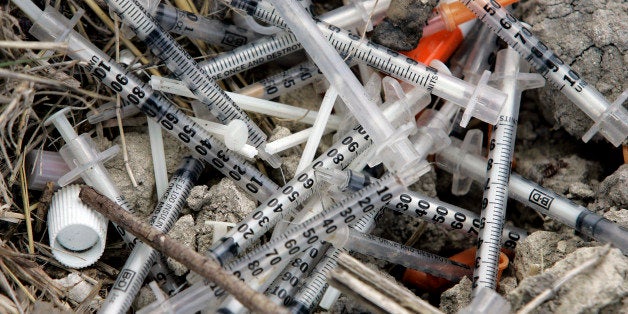 Used syringes and needles are piled on the ground under an underpass on the west side of San Antonio where drug addicts shoot