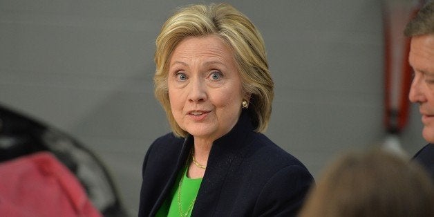 Hillary Clinton participates in a roundtable discussion with students and educators during a campaign event at Kirkwood Commu