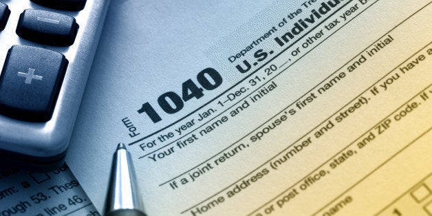 US tax form 1040 with pen and calculator.