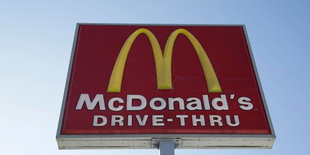 FILE - This Thursday, Jan. 15, 2015, file photo, shows a McDonald's fast food restaurant sign in Chicago. On Monday, Feb. 9, 2015, McDonald's said that a key global sales metric fell 1.8 percent in January, continuing to be weighed down by struggles in Japan and China. (AP Photo/Nam Y. Huh, File)