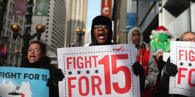 CHICAGO, IL - DECEMBER 05: Demonstrators demanding an increase in pay for fast-food and retail workers protest in the Loop o
