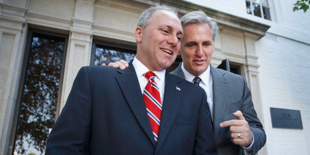 Majority Leader-elect Rep. Kevin McCarthy, R-Calif., right, talks with Rep. Steve Scalise, R-La., left, the newly elected Hou