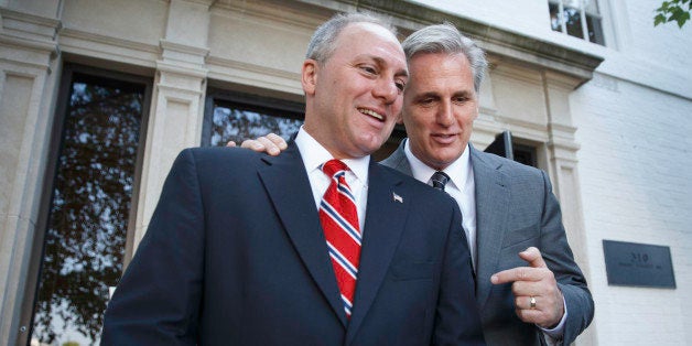 Majority Leader-elect Rep. Kevin McCarthy, R-Calif., right, talks with Rep. Steve Scalise, R-La., left, the newly elected House GOP whip, as they leave the Republican National Committee headquarters on Capitol Hill in Washington, Tuesday, June 24, 2014. The newly-reshuffled House Republican leadership met with reporters for the first time without Rep. Eric Cantor, R-Va., who was defeated in his primary earlier this month and consequently his position as majority leader. (AP Photo/J. Scott Applewhite)