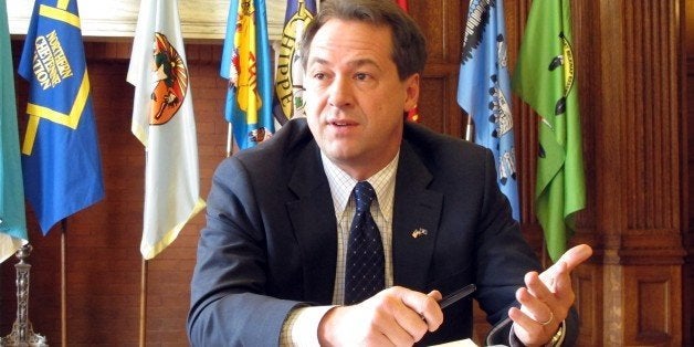 Gov. Steve Bullock responds to a question, Feb. 26, 2013, in Helena, Mont. Bullock spoke in a wide-ranging interview on how he has adapted to his new role in his first two months in office. (AP Photo/Matt Volz)