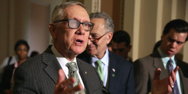 WASHINGTON, DC - MARCH 17: Senate Minority Leader Harry Reid (D-NV) talks to reporters following the Senate Democratic policy luncheon at the U.S. Captiol March 17, 2015 in Washington, DC. Senate Majority Leader Mitch McConnell (R-KY) said he will not move on to a vote to confirm Loretta Lynch, the nominee to replace Attorney General Eric H. Holder, until the Senate votes on the sex trafficking bill. (Photo by Chip Somodevilla/Getty Images)