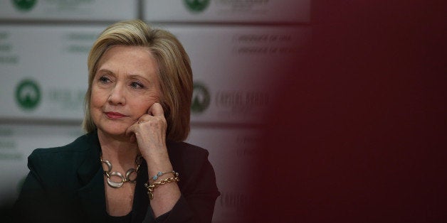 NORWALK, IA - APRIL 15: Democratic presidential hopeful and former Secretary of State Hillary Clinton looks on during a roundtable discussion with members of the small business community at Capital City Fruit on April 15, 2015 in Norwalk, Iowa. Hillary Clinton continues to campaign throughout Iowa as she makes her second bid for President of the United States. (Photo by Justin Sullivan/Getty Images)