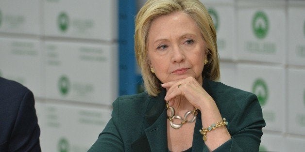 Democratic presidential hopeful and former US Secretary of State, Hillary Clinton participates in a small business roundtable discussion with members of the small business community at Capital City Fruit on April 15, 2015 in Norwalk, Iowa. Clinton has spent the last two days in Iowa to focus on smaller communities in Iowa and have discussions about how to make the economy work for everyday Americans. AFP PHOTO / MICHAEL B. THOMAS (Photo credit should read Michael B. Thomas/AFP/Getty Images)