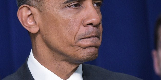 US President Barack Obama pauses as he delivers remarks at a Champions of Change event at the Eisenhower Executive Office Building April 16, 2015 in Washington, DC. Champions of Change highlights issues important to working families. AFP PHOTO/MANDEL NGAN (Photo credit should read MANDEL NGAN/AFP/Getty Images)