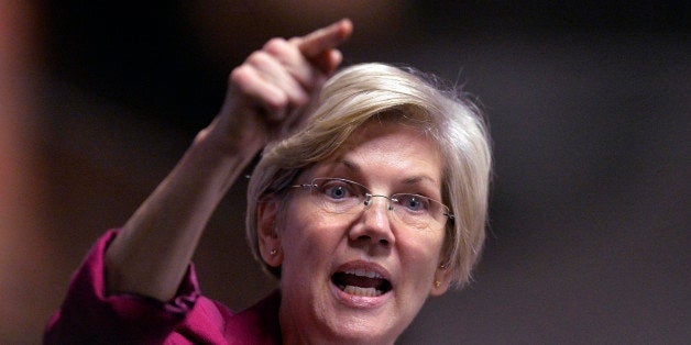 Massachusetts Senator Elizabeth Warren speaks to a rally of supporters of Kentucky senatorial candidate Alison Lundergan Grimes at the Copper & Kings Distillery in Louisville, Ky., Tuesday, Oct. 28, 2014. (AP Photo/Timothy D. Easley)