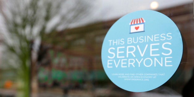 A window sticker on a downtown Indianapolis business, Wednesday, March 25, 2015, shows its objection to the Religious Freedom