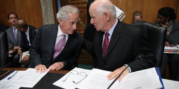WASHINGTON, DC - APRIL 14: Senate Foreign Relations Committee Chairman Sen. Bob Corker (L) (R-TN) confers with ranking member Sen. Ben Cardin (R) (D-MD) during a committee markup meeting on the proposed nuclear agreement with Iran April 14, 2015 in Washington, DC. A bipartisan compromise reached by Corker and Cardin would create a review period that is shorter than originally proposed for a final nuclear deal with Iran and creates compromise language on the removal of sanctions contingent on Iran ceasing support for terrorism. (Photo by Win McNamee/Getty Images)
