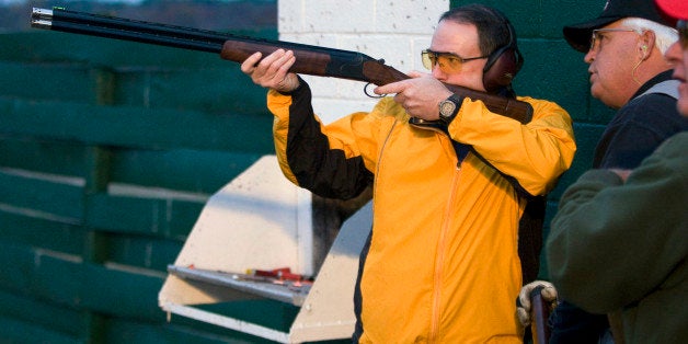 Presidential hopeful, former Arkansas Gov. Mike Huckabee, shoots skeet as Gary Blackwell looks on during a campaign stop at the Spartanburg Gun Club in Pacolet, S.C., Sunday, Nov. 25, 2007. (AP Photo/ Patrick Collard)