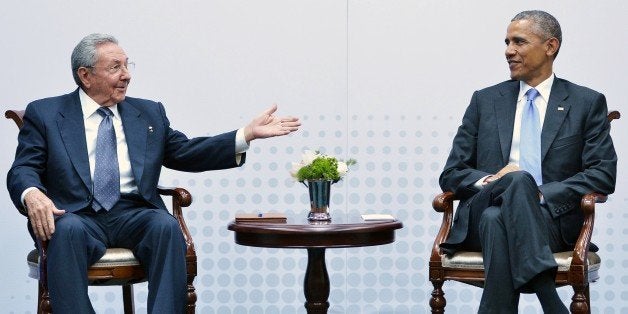 Cuba's President Raul Castro (L) speaks during a meeting with US President Barack Obama on the sidelines of the Summit of the Americas at the ATLAPA Convention center on April 11, 2015 in Panama City. AFP PHOTO/MANDEL NGAN (Photo credit should read MANDEL NGAN/AFP/Getty Images)