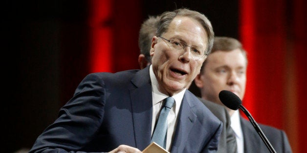 Wayne LaPierre, executive vice president of the National Rifle Association, presents an award during the annual meeting of members at the NRA convention Saturday, April 11, 2015, in Nashville, Tenn. (AP Photo/Mark Humphrey)