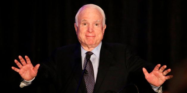 Sen. John McCain, R-Ariz. acknowledges the crowd for their standing ovation as McCain formally announces his candidacy for re-election in 2016 at an Arizona Chamber of Commerce luncheon Tuesday, April 7, 2015, in Phoenix. McCain announced Tuesday that he will run for re-election in 2016, making official a move that has been widely expected for the Republican as he looks to extend his nearly three-decade career in the Senate. (AP Photo/Ross D. Franklin)