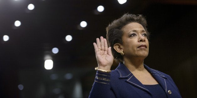 Loretta Lynch is sworn in during her confirmation hearing before the Senate Judiciary Committee January 28, 2015 in Washington, DC. Loretta Lynch, a prosecutor with the US Attorney Eastern District of New York, has been nominated to serve as US Attorney General. AFP PHOTO/BRENDAN SMIALOWSKI (Photo credit should read BRENDAN SMIALOWSKI/AFP/Getty Images)