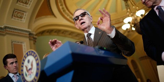 WASHINGTON, DC - APRIL 21: Sen. Minority Leader Harry Reid (D-NV) answers questions from the media following the Senate policy luncheons at the U.S. Capitol April 21, 2015 in Washington, DC. Leaders from both parties have agreed to a compromise on a human trafficking bill, and will move to a vote on Attorney General nominee Loretta Lynch soon. Also pictured is Sen. Charles Schumer (R) (D-NY). (Photo by Win McNamee/Getty Images)