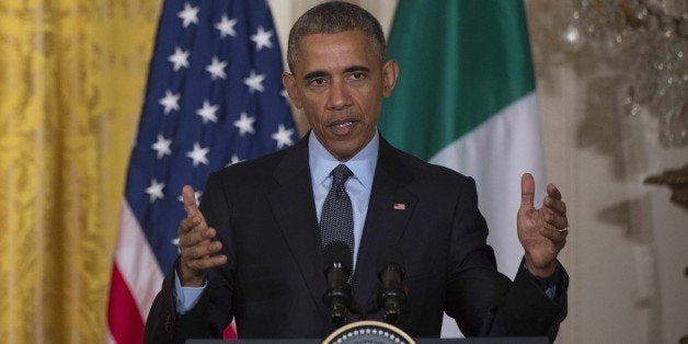 US President Barack Obama speaks during a joint press conference with Italian Prime Minister Matteo Renzi...