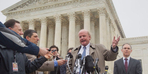 Michael Carvin, center, lead attorney for the petitioners, speaks to reporters outside the Supreme Court in Washington, Wednesday, March 4, 2015, as Oklahoma Attorney General Scott Pruitt listens at right. The Supreme Court heard arguments in King v. Burwell, a major test of President Barack Obama's health overhaul which, if successful, could halt health care premium subsidies in all the states where the federal government runs the insurance marketplaces. (AP Photo/Pablo Martinez Monsivais)