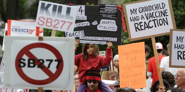 FILE - In this April 8, 2015 file photo, protesters rally against a measure requiring California schoolchildren to get vaccin