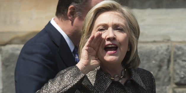 Democratic Presidential hopeful Hillary Clinton shouts out to college students after speaking during the Hillary Rodham Clinton Award for Advancing Women in Peace and Security at Georgetown University in Washington, DC, April 22, 2015. AFP PHOTO / SAUL LOEB (Photo credit should read SAUL LOEB/AFP/Getty Images)