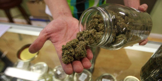 LOS ANGELES, CA - OCTOBER 19: Dave Warden, a bud tender at Private Organic Therapy (P.O.T.), a non-profit co-operative medical marijuana dispensary, displays various types of marijuana available to patients on October 19, 2009 in Los Angeles, California. Attorney General Eric Holder announced new guidelines today for federal prosecutors in states where the use of marijuana for medicinal purposes is allowed under state law. Federal prosecutors will no longer trump the state with raids on the southern California dispensaries as they had been doing, but Los Angeles County District Attorney Steve Cooley recently began a crackdown campaign that will include raids against the facilities. Cooley maintains that virtually all marijuana dispensaries are in violation of the law because they profit from their product. The city of LA has been slow to come to agreement on how to regulate its 800 to 1,000 dispensaries. Californians voted to allow sick people with referrals from doctors to consume cannabis with the passage of state ballot Proposition 215 in 1996 and a total of 14 states now allow the medicinal use of marijuana. (Photo by David McNew/Getty Images)