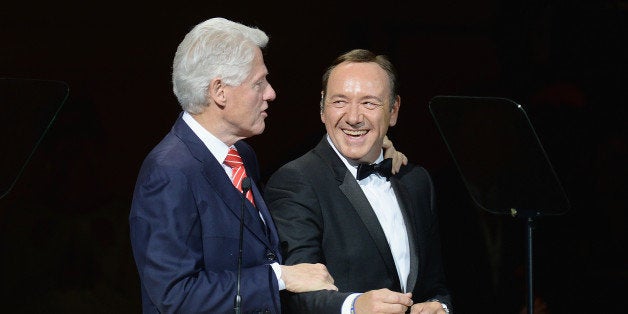 NEW YORK, NY - APRIL 17: President Bill Clinton and Kevin Spacey speak during the 25th Anniversary Rainforest Fund Benefit Concert at Carnegie Hall on April 17, 2014 in New York City. (Photo by Jamie McCarthy/Getty Images)