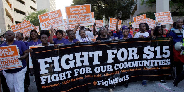 Protestors march in support of raising the minimum wage to $15 an hour as part of an expanding national movement known as Fi