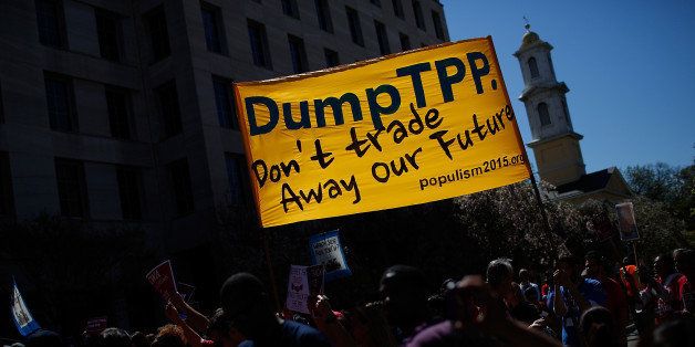 WASHINGTON, DC - APRIL 20: Protesters take part in a 'Don't Trade Our Future' march organized by the group Campaign for America's Future April 20, 2015 in Washington, DC. The event was part of the Populism 2015 Conference which is conducting their conference with the theme 'Building a Movement for People and the Planet.' (Photo by Win McNamee/Getty Images)
