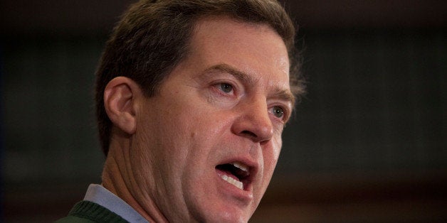 PERRY, IA - JANUARY 02: Kansas Governor Sam Brownback gives a speech supporting Texas Governor and Republican presidential candidate Rick Perry at the Hotel Pattee on January 2, 2012 in Perry, Iowa. The GOP presidential contenders are crisscrossing Iowa in the final stretch of campaigning in the state before the January 3rd caucus, the first test the candidates must face before becoming the Republican presidential nominee. (Photo by Andrew Burton/Getty Images)