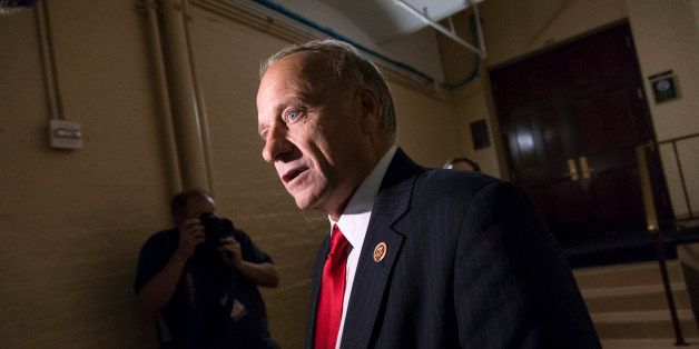 In this Sept. 28, 2013, photo, Rep. Steve King, R-Iowa, arrives for a closed-door meeting with fellow Republicans as the House of Representatives works into the night to pass a bill to fund the government, at the Capitol in Washington. The Republican Partyâs two Kings in Congress both voted against GOP leadersâ latest effort to prevent President Barack Obamaâs health care overhaul from becoming entrenched, but for opposite reasons. New York congressman Peter King says it was a mistake to link curbing âObamacareâ with averting a government shutdown. Iowa congressman King characterizes Boehnerâs measure to delay making millions of people buy health insurance for year as a retreat from defunding the new health care law entirely. (AP Photo/J. Scott Applewhite)
