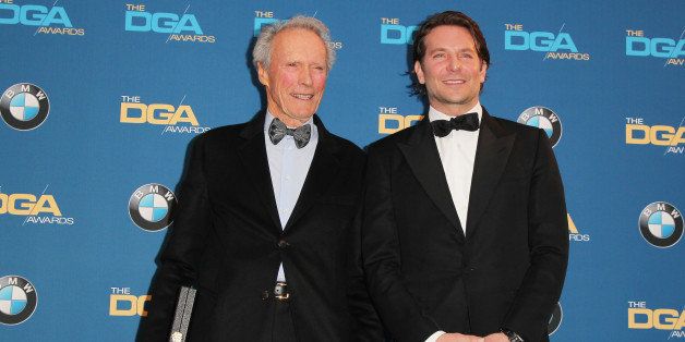 CENTURY CITY, CA - FEBRUARY 07: Actor/director Clint Eastwood (L), recipient of the Feature Film Nomination Plaque for 'American Sniper,' poses with actor Bradley Cooper in the press room at the 67th Annual Directors Guild Of America Awards at the Hyatt Regency Century Plaza on February 7, 2015 in Century City, California. (Photo by David Buchan/Getty Images)