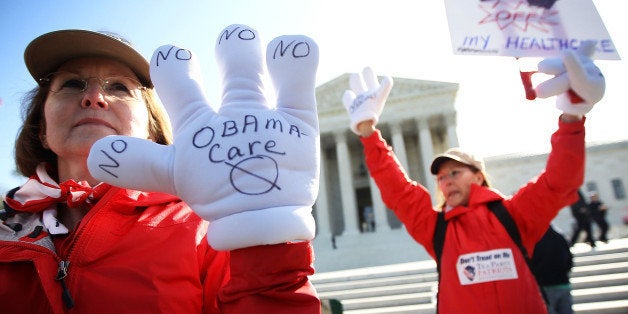 WASHINGTON, DC - MARCH 27: Sisters and Tea Party members of Atlanta, Georgia, Judy Burel (L) and Janis Haddon (R), protest the Obamacare in front of the U.S. Supreme Court March 27, 2012 in Washington, DC. The Supreme Court continued to hear oral arguments on the Patient Protection and Affordable Care Act. (Photo by Alex Wong/Getty Images)