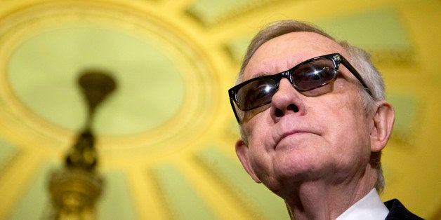 Senate Minority Leader Harry Reid of Nev. pauses during a news conference on Capitol Hill in Washington, Tuesday, April 14, 2