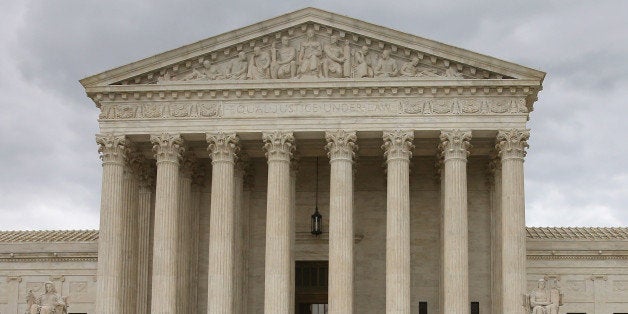 WASHINGTON, DC - APRIL 27: An anti-gay marriage protester stands in front of the U.S. Supreme Court Building April 27, 2015