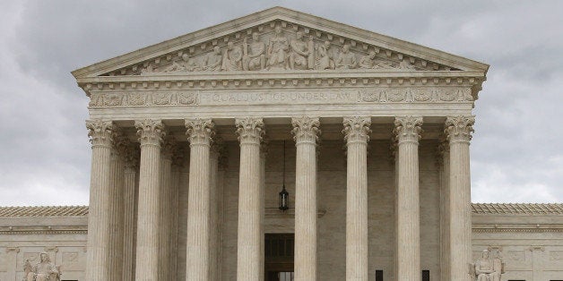 WASHINGTON, DC - APRIL 27: An anti-gay marriage protester stands in front of the U.S. Supreme Court Building April 27, 2015 in Washington, DC. The high court is scheduled to hear arguments April 28, in the case of Obergefell v. Hodges, that will ultimately decide whether states will still be allowed to ban same sex marriage and refuse to recognize the rights of couples married in other states. (Photo by Mark Wilson/Getty Images)