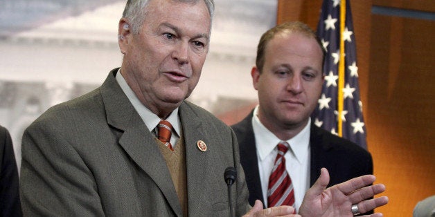 Rep. Dana Rohrabacher, R-Calif., left, accompanied by Rep. Jared Polis, D-Colo., speaks during a news conference on Capitol Hill in Washington, Thursday, Nov, 13, 2014, to discuss marijuana laws. Members of Congress from states with legal pot are banding together to tell their colleagues on Capitol Hill not to interfere with state drug laws. (AP Photo/Lauren Victoria Burke)