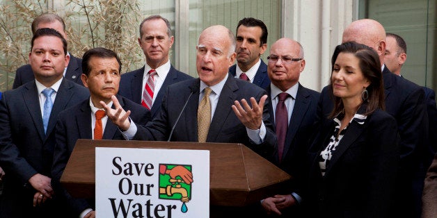 Gov. Jerry Brown talks during a news conference after meeting with several California mayors to discuss water conservation at