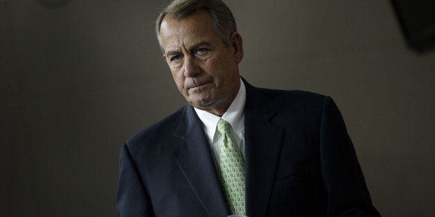 Speaker of the House John Boehner (R-OH) arrives to speak during a weekly briefing on Capitol Hill April 23, 2015 in Washington, DC. AFP PHOTO/BRENDAN SMIALOWSKI (Photo credit should read BRENDAN SMIALOWSKI/AFP/Getty Images)