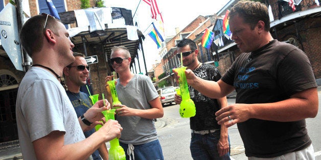 From left to right, Joshua Bernard, Jason Hunt, Dwight Beckett, Royce Cottrell and Chris Billings, tourists from Oklahoma, drink on Bourbon Street and say they are "playing it by ear,'' regarding a possible evacuation as Gustav enters the Gulf of Mexico, as the group is seen in New Orleans, Thursday, Aug. 28, 2008. (AP Photo/Cheryl Gerber)