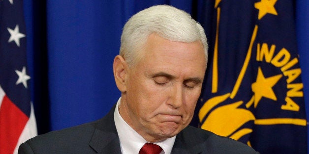 Indiana Gov. Mike Pence listens to a question during a news conference, Tuesday, March 31, 2015, in Indianapolis. Pence said that he wants legislation on his desk by the end of the week to clarify that a new religious-freedom law does not allow discrimination. The law has triggered an outcry, with businesses and organizations voicing concern and some states barring government-funded travel to the Midwestern state. (AP Photo/Darron Cummings)