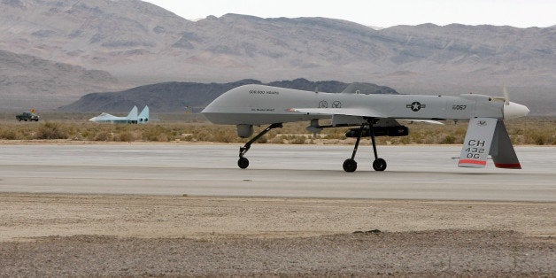 INDIAN SPRINGS, NV - APRIL 16: An MQ-1B Predator unmanned aircraft system (UAS) taxis April 16, 2009 at Creech Air Force Base in Indian Springs, Nevada. The United States Air Force currently has 116 of the aircraft in its UAS fleet with 31 of them airborne at any given moment, flying combat air patrols over Iraq and Afghanistan. After being launched overseas, the Predators are flown by pilots and sensor operators from ground control stations at Creech and four Air National Guard units in the Unites States. In addition to carrying two laser-guided Hellfire missiles, the Predators have cameras that provide full-motion video that is in high demand for use in intelligence, surveillance and reconnaissance. The demand for the aircraft was highlighted in February when the Air Force reached the milestone of 500,000 flying hours for the Predator. It took 12 years to reach 250,000 flying hours and only about two years to double it. It is expected that the Air Force will reach one million flying hours in less than three years. (Photo by Ethan Miller/Getty Images)