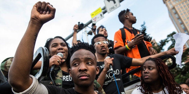 BALTIMORE, MD - APRIL 29: Students from Baltimore colleges and high schools march in protest chanting 'Justice for Freddie Gray' on April 29, 2015 in Baltimore, Maryland. Baltimore remains on edge in the wake of the death of Freddie Gray, though the city has been largely peaceful following a day of rioting this past Monday. Gray, 25, was arrested for possessing a switch blade knife April 12 outside the Gilmor Houses housing project on Baltimore's west side. According to his attorney, Gray died a week later in the hospital from a severe spinal cord injury he received while in police custody. (Photo by Andrew Burton/Getty Images)