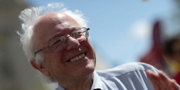 WASHINGTON, DC - APRIL 20: U.S. Sen. Bernie Sanders (I-VT) participates in a 'Don't Trade Our Future' march organized by the