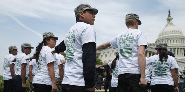 WASHINGTON, DC - MAY 20: A group of military 'DREAMers', undocumented youth who aspire to serve the United States in uniform but are prohibited from doing due to their immigration status, rally in front of the U.S. Capitol May 20, 2014 in Washington, DC. The young people were showing their support for the Enlist Act, co-sponsored by Rep. Jeff Denham (R-VA) and Rep. Tammy Duckworth (D-IL), which would amendment to the National Defense Authorization Act to allow some undocumented immigrants to join the military. (Photo by Chip Somodevilla/Getty Images)