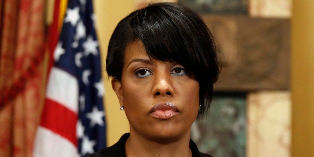 Mayor Stephanie Rawlings-Blake prepares to speak at a media availability at City Hall, Friday, May 1, 2015 in Baltimore. Rawlings-Blake says five of six officers charged in the death of Freddie Gray are in custody. State's Attorney Marilyn J. Mosby announced criminal charges Friday against all six officers. (AP Photo/Alex Brandon)