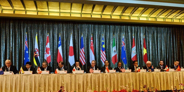 Trade ministers and representatives attend a press conference at the Trans-Pacific Partnership (TPP) ministerial meeting in Singapore on February 25, 2014. Asia Pacific trade ministers began a fresh round of talks in Singapore February 22 for a huge US-led Pacific free trade area, hoping to conclude a deal this year after missing a deadline in 2013. AFP PHOTO / ROSLAN RAHMAN (Photo credit should read ROSLAN RAHMAN/AFP/Getty Images)