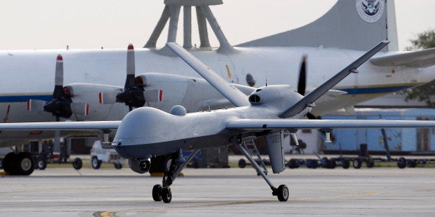 FILE - In this Nov. 8, 2011 file photo, a Predator B unmanned aircraft taxis at the Naval Air Station in Corpus Christi, Texas. Missiles from U.S. drones slammed into militant hideouts overnight in northwestern Pakistan, killing more than a dozen of suspected insurgents and marking the resumption of the CIA-led program after a nearly six-month break, officials said Thursday, June 12, 2014. (AP Photo/Eric Gay, File)