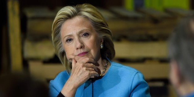 Hillary Clinton participates in a round table discussion with Whitney Brothers management and employees April 20, 2015 in Keene, New Hampshire. The former first lady and secretary of state -- now the clear frontrunner for the Democratic Party presidential ticket -- will meet with students, teachers and small business employees, according to her campaign team. AFP PHOTO/DON EMMERT (Photo credit should read DON EMMERT/AFP/Getty Images)